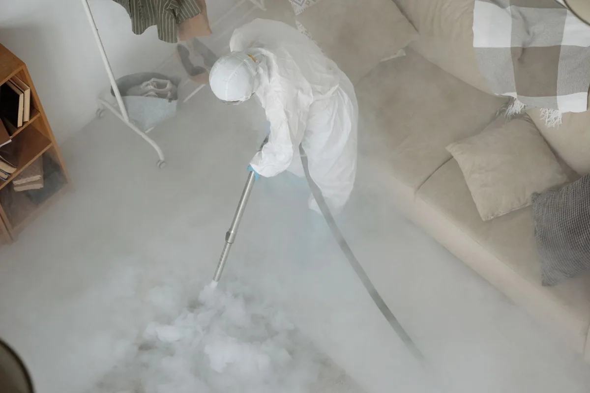 Biohazard cleanup technician in protective equipment, Sussex, WI
